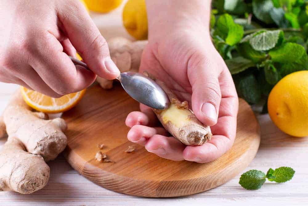 peeling ginger using a spoon