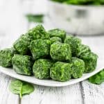 Frozen spinach cubes on plate