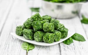 Frozen spinach cubes on plate