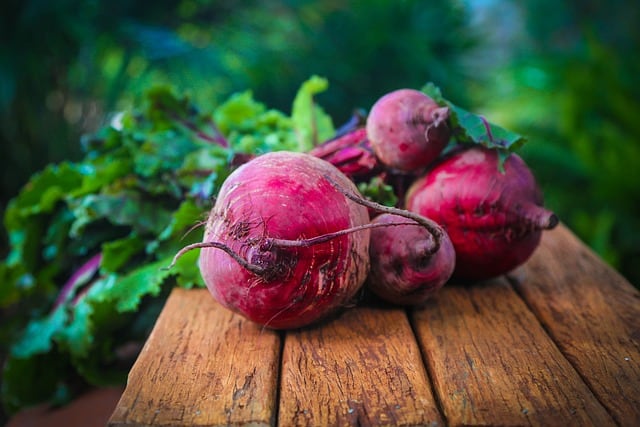 whole beetroots on a wooden table